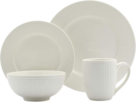 Modern white ceramic dinnerware set with plates and bowls in a minimal design